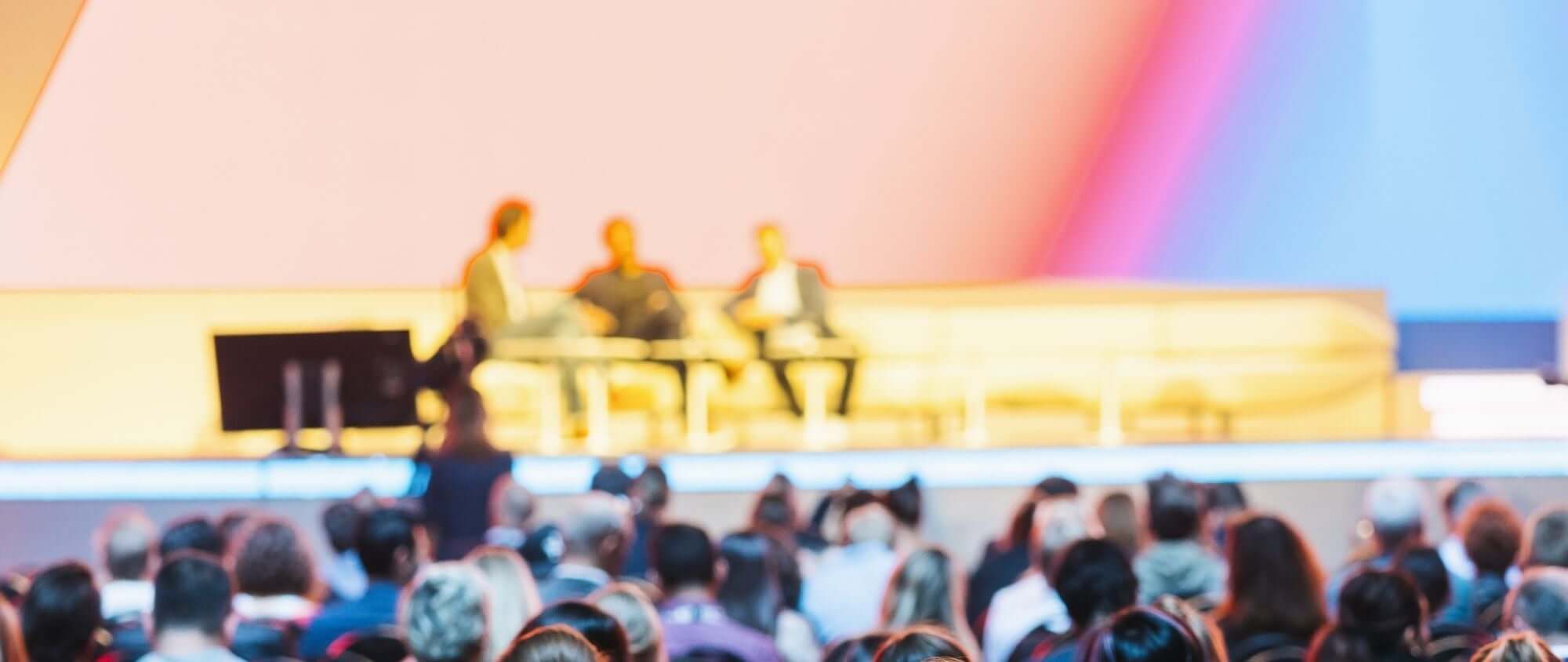 people talking on a stage